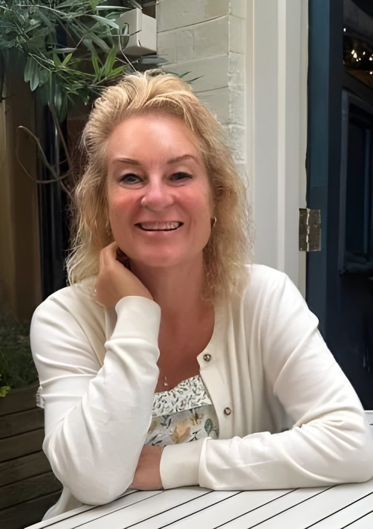 Portrait of Jo Oxley, BACP Accredited Psychotherapist and founder of Optima Health Services, smiling warmly